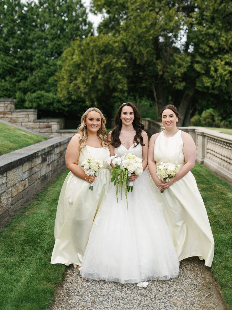 Luxury bridesmaids inspiration featuring elegant pastel cream silk gowns complementing a magnificent white wedding dress