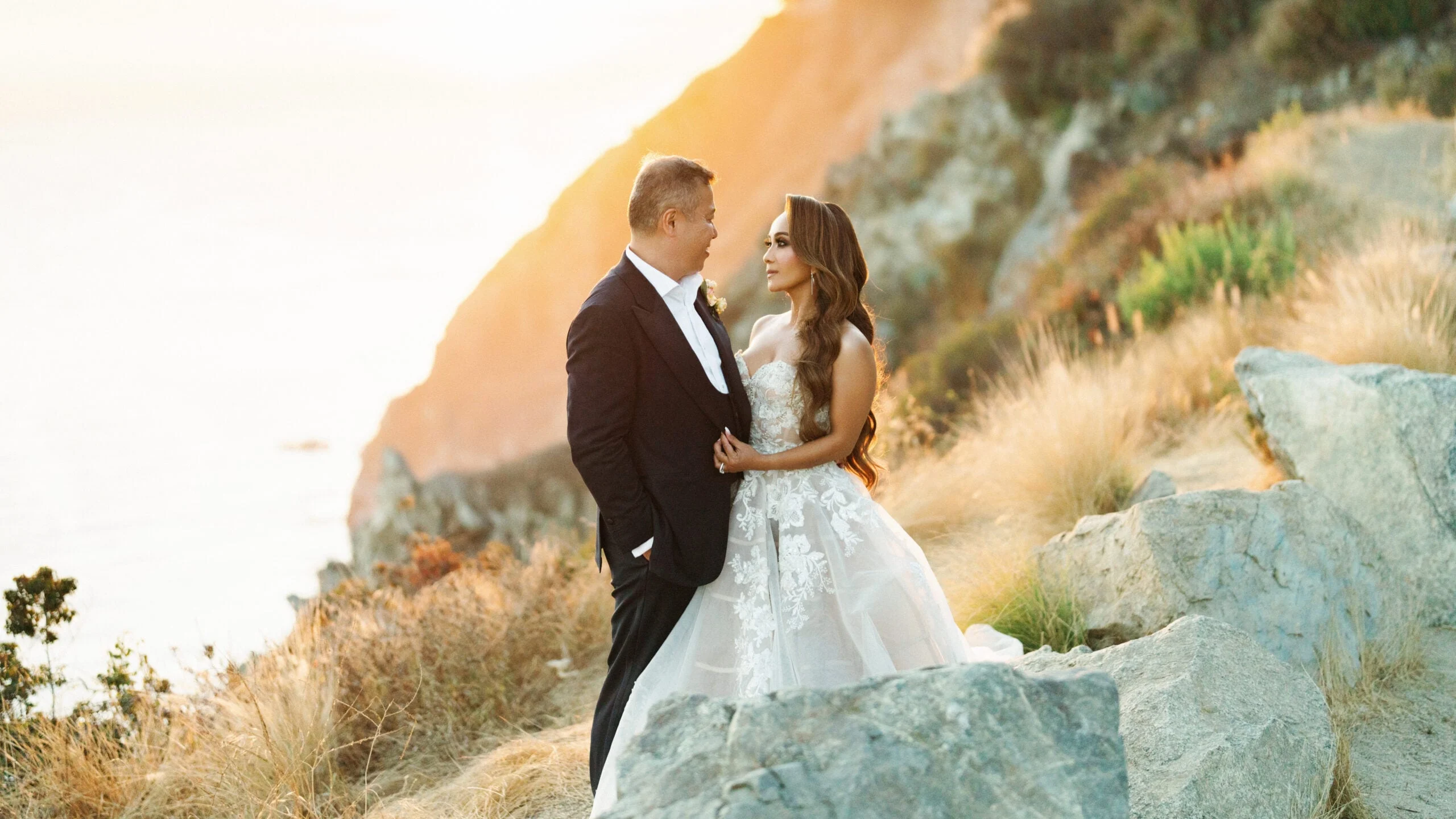 Newlyweds on a rocky Big Sur coastline